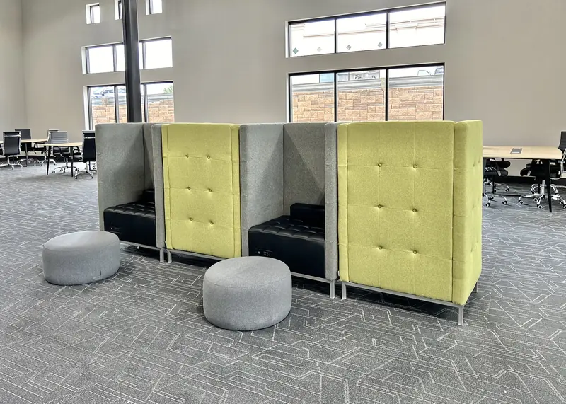 High-backed coworking booths with individual tables