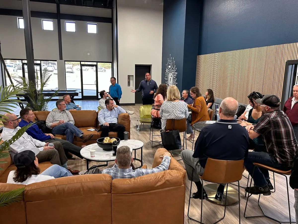 Our event floor full, with guests seated at round tables across the room