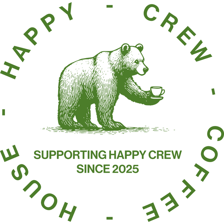 The Happy Crew Coffee House badge: an engraved bear holding a cup of coffee, ringed by the cafe's name, above the words Supporting Happy Crew since 2025