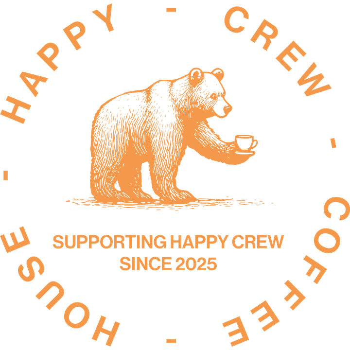 The Happy Crew Coffee House badge: an engraved bear holding a cup of coffee, ringed by the cafe's name, above the words Supporting Happy Crew since 2025